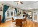 Dining room featuring large windows, hardwood floors, and an open view into the living room at 1215 Jackson St, Denver, CO 80206