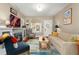 Cozy living room with a fireplace, hardwood floors, and ample natural light at 1215 Jackson St, Denver, CO 80206
