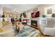 Bright and inviting living room with hardwood floors, a fireplace, and an open layout at 1215 Jackson St, Denver, CO 80206