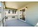 Relaxing covered deck with sliding glass door and exterior lighting at 1889 Water Birch Way, Castle Rock, CO 80108