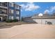 Outdoor basketball court with hoop and a building in the background for a fun recreational activity at 4451 S Ammons St # 4-108, Littleton, CO 80123