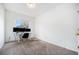 Versatile room is great for a home office, featuring natural light and a neutral color palette for productivity and comfort at 4451 S Ammons St # 4-108, Littleton, CO 80123