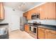 Well-equipped kitchen boasts stainless steel appliances, plenty of cabinet space, and modern finishes for cooking enjoyment at 4451 S Ammons St # 4-108, Littleton, CO 80123