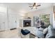 Inviting living room with a modern fireplace, comfortable seating, and access to a private balcony for relaxation at 4451 S Ammons St # 4-108, Littleton, CO 80123