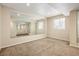 Finished basement with a large mirror, great for a home gym or recreational space at 4860 W 125Th Ave, Broomfield, CO 80020