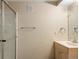 Bathroom featuring a shower, single sink vanity with light wood cabinets, and neutral walls at 4860 W 125Th Ave, Broomfield, CO 80020