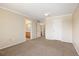 Spacious carpeted bedroom showcasing doors to dual vanities and closets at 4860 W 125Th Ave, Broomfield, CO 80020
