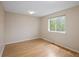 Bedroom with neutral walls, laminate flooring, white trim and one window at 4860 W 125Th Ave, Broomfield, CO 80020