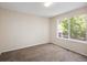 Bright bedroom offers a large window with a peaceful view, creating a serene retreat at 4860 W 125Th Ave, Broomfield, CO 80020