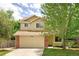 Charming two-story home with a well-manicured lawn, brick accents, and an attached two-car garage at 4860 W 125Th Ave, Broomfield, CO 80020