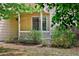 Charming covered front porch with white railings and ample greenery at 4860 W 125Th Ave, Broomfield, CO 80020