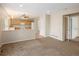 Open-concept living area flows into the kitchen, creating a seamless and inviting space at 4860 W 125Th Ave, Broomfield, CO 80020