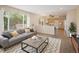 Inviting living area with large windows and seamless connection to the kitchen, perfect for modern living and entertaining at 4860 W 125Th Ave, Broomfield, CO 80020