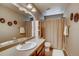 Clean bathroom with shower/tub combo and vanity at 1567 S Dallas Cir, Denver, CO 80247