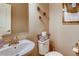 Clean bathroom with single sink vanity and toilet at 1567 S Dallas Cir, Denver, CO 80247