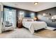 Main bedroom with dark walls and plush bedding at 1567 S Dallas Cir, Denver, CO 80247