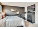 Bedroom with a king-size bed, dresser and exercise bike at 1567 S Dallas Cir, Denver, CO 80247