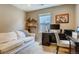 Home office with desk, couch, and ample storage at 1567 S Dallas Cir, Denver, CO 80247