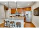 Kitchen with granite countertop and island seating at 1567 S Dallas Cir, Denver, CO 80247