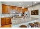 Modern kitchen with granite countertops and stainless steel appliances at 1567 S Dallas Cir, Denver, CO 80247