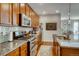 Spacious kitchen featuring granite countertops and ample cabinetry at 1567 S Dallas Cir, Denver, CO 80247