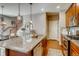 Island kitchen with granite countertops and stainless steel appliances at 1567 S Dallas Cir, Denver, CO 80247