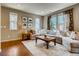 Spacious living room with L-shaped sectional sofa at 1567 S Dallas Cir, Denver, CO 80247