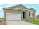 Charming single-Gathering home featuring a two-car garage and a well-manicured front lawn at 2151 Christina St, Fort Lupton, CO 80621