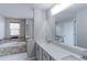 Bright bathroom featuring dual sinks, a separate shower, and a soaking tub at 14214 Lakeview Ln, Broomfield, CO 80023