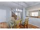 Bright dining area with hardwood flooring, view of staircase, and contemporary light fixture at 14214 Lakeview Ln, Broomfield, CO 80023