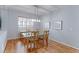 Well-lit dining space with hardwood floors, modern chandelier, and neutral decor at 14214 Lakeview Ln, Broomfield, CO 80023