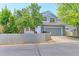 Inviting two-story home with a fenced yard and lush green trees at 14214 Lakeview Ln, Broomfield, CO 80023