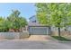 Charming two-story home with a grey garage door and neatly trimmed landscaping at 14214 Lakeview Ln, Broomfield, CO 80023
