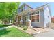 Beautiful home with a stone porch and well-maintained front yard landscaping at 14214 Lakeview Ln, Broomfield, CO 80023