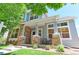 Charming home featuring a stone-accented front porch, perfect for relaxing outdoors at 14214 Lakeview Ln, Broomfield, CO 80023
