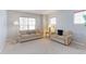 Comfortable living room with two couches, side table with lamp, and neutral-toned carpet at 14214 Lakeview Ln, Broomfield, CO 80023
