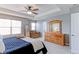 Spacious main bedroom featuring a tray ceiling, a dressing mirror, and a large wooden dresser at 14214 Lakeview Ln, Broomfield, CO 80023