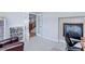 Cozy office space boasts a fireplace and French doors with a view of the staircase at 14214 Lakeview Ln, Broomfield, CO 80023