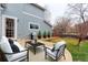 Outdoor patio with white furniture, a grill and fenced-in yard with grass at 14214 Lakeview Ln, Broomfield, CO 80023
