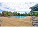 Community pool with lounge chairs and sun shelter at 14214 Lakeview Ln, Broomfield, CO 80023