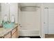 Well-lit bathroom featuring a modern vessel sink and a tub-shower with tiled surround at 18601 E Water Dr # A, Aurora, CO 80013