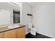 Well-lit bathroom with a vanity, toilet, and granite countertops at 18601 E Water Dr # A, Aurora, CO 80013