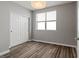 This is a picture of a bedroom that includes modern wood floors and a sliding closet at 18601 E Water Dr # A, Aurora, CO 80013