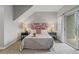 The Primary bedroom features a contemporary bed with lamps on both side tables at 18601 E Water Dr # A, Aurora, CO 80013