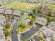 Aerial view showing community layout, including pool, landscaping, and parking at 18601 E Water Dr # A, Aurora, CO 80013