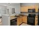 This kitchen features granite countertops and stainless-steel appliances at 18601 E Water Dr # A, Aurora, CO 80013