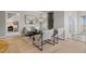 Stylish living area with comfortable seating, unique artwork, and an open view into the bedroom adding dimension to the space at 18601 E Water Dr # A, Aurora, CO 80013