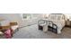 Inviting bedroom with natural light, a stylish chair, and neutral decor at 9636 W Chatfield Ave # C, Littleton, CO 80128