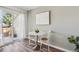 Cozy dining area with natural light, a small table, and sliding glass door access to the patio at 9636 W Chatfield Ave # C, Littleton, CO 80128