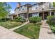Charming townhouse with landscaped front yard and inviting entrance at 9636 W Chatfield Ave # C, Littleton, CO 80128